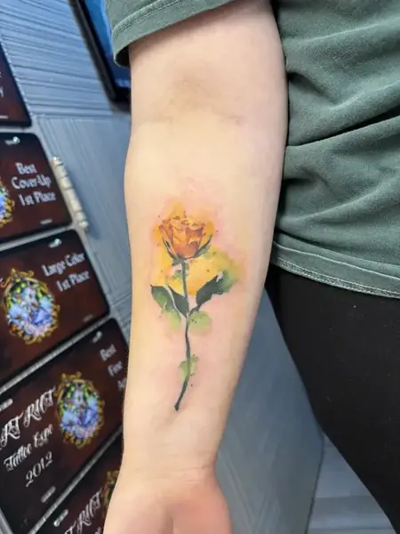 Watercolor tattoo by Caged Raven
